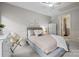 This bedroom is styled with neutral paint and carpet, and receives plenty of natural light at 9021 Unbridle Ln, Waxhaw, NC 28173