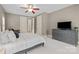 Calm bedroom with neutral tones, a ceiling fan, and a chest of drawers at 9021 Unbridle Ln, Waxhaw, NC 28173