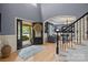 Elegant foyer showcases hardwood floors, an open floor plan, and a stunning view into the formal living room at 9021 Unbridle Ln, Waxhaw, NC 28173