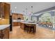 Gourmet kitchen with a large island, pendant lighting, and an adjacent dining area at 9021 Unbridle Ln, Waxhaw, NC 28173