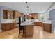 Spacious kitchen with stainless steel appliances, an island and custom wood cabinets at 9021 Unbridle Ln, Waxhaw, NC 28173