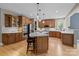 Spacious kitchen with stainless steel appliances, granite countertops, and a breakfast bar at 9021 Unbridle Ln, Waxhaw, NC 28173