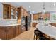Well-equipped kitchen with custom cabinets, double ovens, and a stylish breakfast bar at 9021 Unbridle Ln, Waxhaw, NC 28173