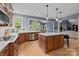 Modern kitchen featuring sleek countertops, stainless steel appliances, and a center island at 9021 Unbridle Ln, Waxhaw, NC 28173