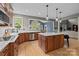 Updated kitchen with stainless appliances, white countertops and a view into the breakfast nook at 9021 Unbridle Ln, Waxhaw, NC 28173