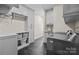 Spacious laundry room with sink, built-in storage, and modern washer and dryer at 9021 Unbridle Ln, Waxhaw, NC 28173