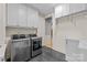 Well-equipped laundry room with modern appliances and ample cabinet space at 9021 Unbridle Ln, Waxhaw, NC 28173