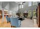 Two-story living room featuring large windows, fireplace, and hardwood floors at 9021 Unbridle Ln, Waxhaw, NC 28173