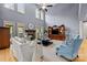 Elegant living room featuring tall windows, a stone fireplace, and comfortable seating at 9021 Unbridle Ln, Waxhaw, NC 28173