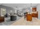 Expansive living room with comfortable seating, bar area, and ample natural light at 9021 Unbridle Ln, Waxhaw, NC 28173