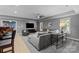 Spacious living room with cozy seating arrangement, stylish decor, and a serene ambiance at 9021 Unbridle Ln, Waxhaw, NC 28173
