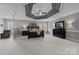 Spacious primary bedroom features a tray ceiling, sitting area, and neutral decor at 9021 Unbridle Ln, Waxhaw, NC 28173