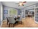 Office featuring natural light from an arched window and doorway into the living room at 9021 Unbridle Ln, Waxhaw, NC 28173