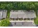 Aerial view of townhomes shows parking, landscaping, yards, and privacy fences, offering great curb appeal in a community at 916 Coffee Tree Ln, Rock Hill, SC 29732