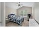 Comfortable bedroom with vaulted ceiling, ceiling fan, window and cozy blue quilt at 916 Coffee Tree Ln, Rock Hill, SC 29732