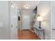 Welcoming entryway with hardwood floors, a table lamp, and staircase at 916 Coffee Tree Ln, Rock Hill, SC 29732