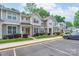 Charming townhome community showcases manicured lawns, stone accents, and convenient parking in a desirable location at 916 Coffee Tree Ln, Rock Hill, SC 29732