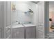 Convenient laundry room with modern washer and dryer units and shelving at 916 Coffee Tree Ln, Rock Hill, SC 29732