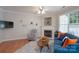 Bright living room with fireplace, hardwood floors, and comfortable seating at 916 Coffee Tree Ln, Rock Hill, SC 29732