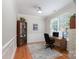 Bright office space with a large window, built-in shelving, and a comfortable workspace at 916 Coffee Tree Ln, Rock Hill, SC 29732