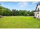 Expansive, green backyard featuring mature trees and well-maintained lawn at 930 Hawley Rd, McConnells, SC 29726