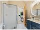 Bathroom with a stand up shower, blue vanity, and wood-look tile flooring at 930 Hawley Rd, McConnells, SC 29726