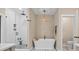 Bathroom featuring a glass shower and soaking tub at 930 Hawley Rd, McConnells, SC 29726