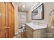 Bathroom with marble countertop vanity, wood cabinets, and a stand-up shower at 930 Hawley Rd, McConnells, SC 29726