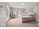 A bright bedroom featuring carpet, and two large windows, filling the room with natural light at 930 Hawley Rd, McConnells, SC 29726