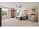 Spacious bedroom with a ceiling fan, natural light, sitting chair, and ample space at 930 Hawley Rd, McConnells, SC 29726
