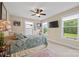 Cozy bedroom with natural light, ceiling fan, neutral walls and carpet, plus a television mounted on the wall at 930 Hawley Rd, McConnells, SC 29726