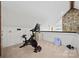 Home gym features vaulted ceilings, stone fireplace and exercise bike at 930 Hawley Rd, McConnells, SC 29726