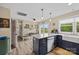 Open kitchen with an island, granite countertops, pendant lighting, and stainless steel appliances at 930 Hawley Rd, McConnells, SC 29726