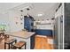 Charming kitchen with blue cabinetry, stainless steel appliances, and butcher block countertops at 930 Hawley Rd, McConnells, SC 29726