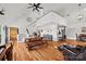 Bright and airy living room with wood floors, high ceilings, and a view of the loft area at 930 Hawley Rd, McConnells, SC 29726
