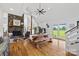 Open living space featuring a stone fireplace, wood floors, and a vaulted ceiling at 930 Hawley Rd, McConnells, SC 29726