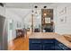 Living room featuring stone fireplace, wood floors, and dining table at 930 Hawley Rd, McConnells, SC 29726