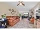 Open-concept living room showcasing a leather sofa, rug, and connection to the kitchen area at 930 Hawley Rd, McConnells, SC 29726