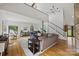 Spacious living room with hardwood floors, modern decor, and a staircase leading to the upper level at 930 Hawley Rd, McConnells, SC 29726