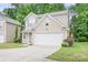 Attractive two-story home with a two car garage, tasteful landscaping, and inviting curb appeal at 9437 Macquarie Ln, Charlotte, NC 28227