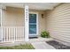 Welcoming front door with sidelights and a small porch, enhancing the home's entryway at 9437 Macquarie Ln, Charlotte, NC 28227