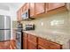 Functional kitchen features stainless steel appliances, granite countertops, and ample cabinet space at 9437 Macquarie Ln, Charlotte, NC 28227