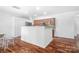 Bright kitchen features hardwood floors, granite countertops, and stainless steel appliances at 9437 Macquarie Ln, Charlotte, NC 28227