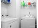 Well-lit laundry room with a side-by-side washer and dryer, and white wire shelving at 9437 Macquarie Ln, Charlotte, NC 28227
