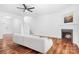 Bright living room with hardwood floors, a fireplace, and a modern sofa at 9437 Macquarie Ln, Charlotte, NC 28227