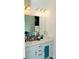 Bathroom with double sinks, vanity with ample storage, and modern lighting fixtures at 10100 Jack Nicklaus Dr, Lancaster, SC 29720