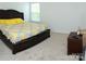 Bedroom featuring a dark wood bedframe and a colorful bedspread at 10100 Jack Nicklaus Dr, Lancaster, SC 29720