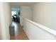 Hallway leading to a home office and other rooms, showcasing natural light at 10100 Jack Nicklaus Dr, Lancaster, SC 29720
