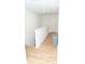 Bright hallway with light wood floors and a neutral color scheme at 10100 Jack Nicklaus Dr, Lancaster, SC 29720