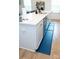 Kitchen island with white cabinets, a stainless steel dishwasher, and a pull down faucet at 10100 Jack Nicklaus Dr, Lancaster, SC 29720